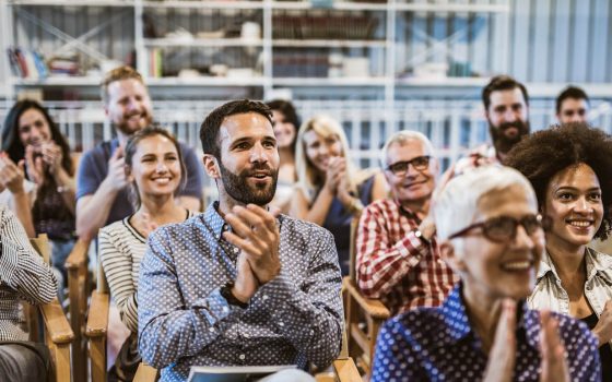 People at business meeting clapping